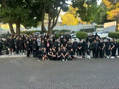 Runners in black on a tribute run for the women killed in Ekurhuleni, September 2026.